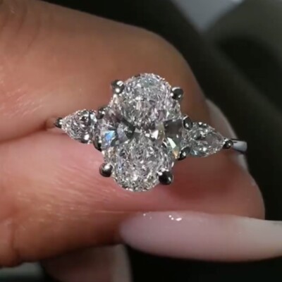 3.59 TCW Oval Cut Moissanite Three Stone Engagement Ring 14K White Gold Plated
