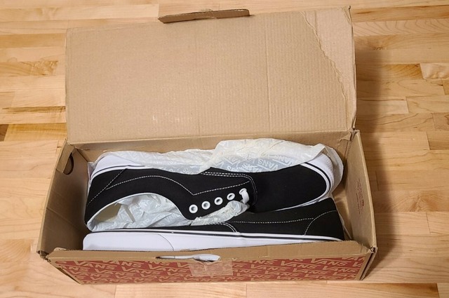 vans era trainers black
