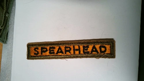 MILITARY PATCH SEW ON OLDER TAB US ARMY SPEARHEAD BLACK ON GOLD WW2 ERA