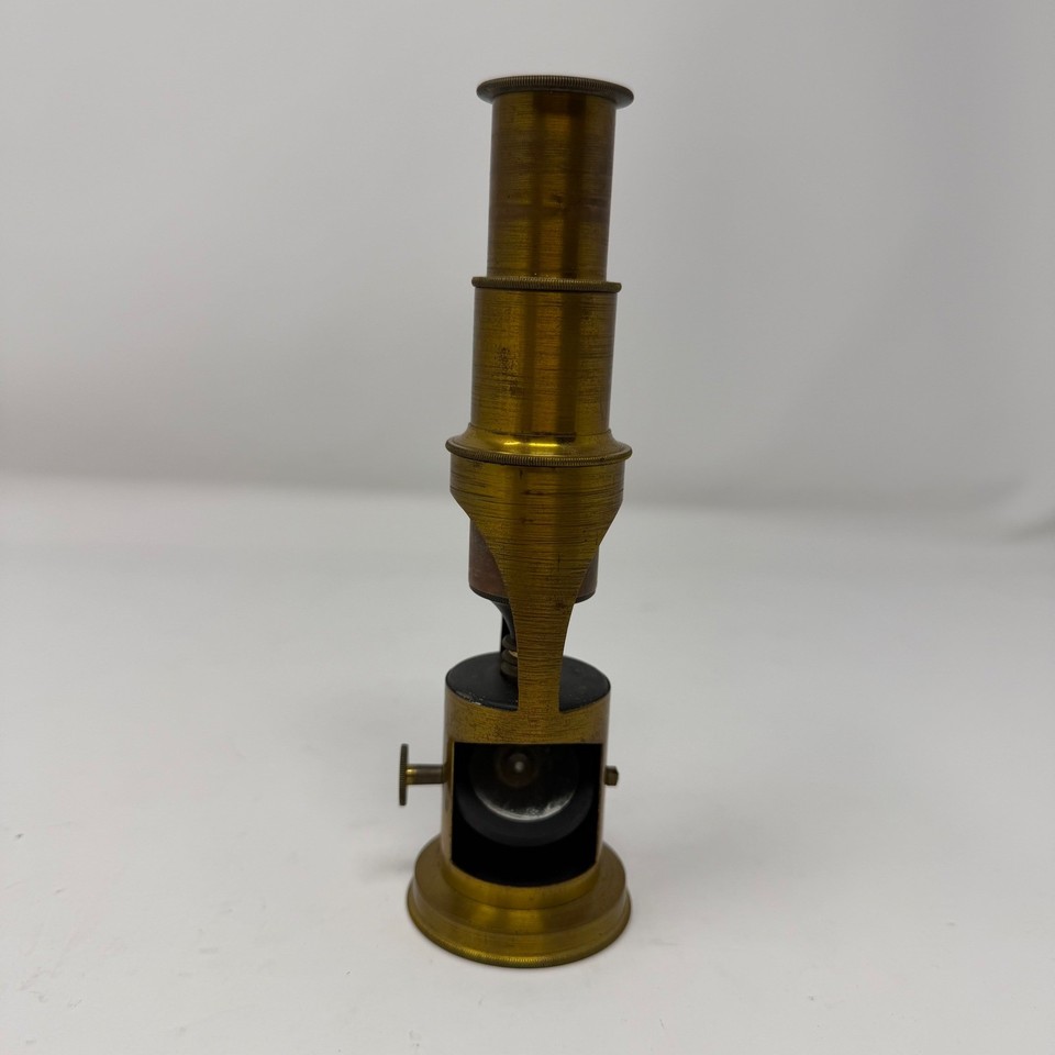 A Victorian-era brass drum microscope with aged patina — a functional antique that doubles as a jaw-dropping desktop sculpture.