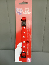 NEW CAT COLLAR IN RED, WITH PAW PRINTS ON & BELL. WITH SAFETY BUCKLE RELEASES.