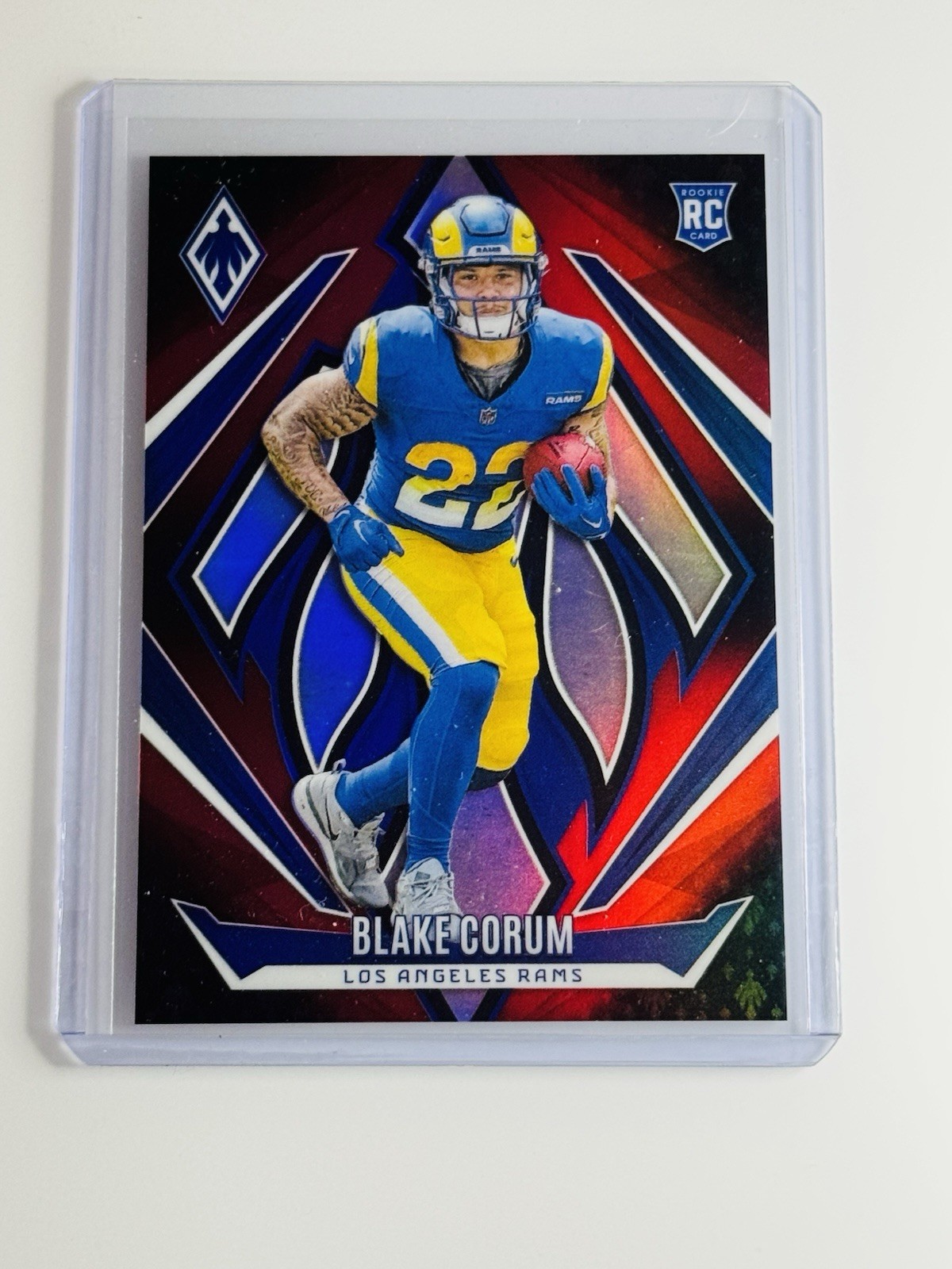 2024 Panini Phoenix - Rookies Blake Corum #158 Red Fade /299 (RC)
