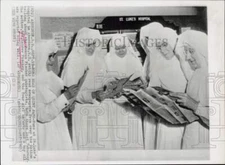 1963 Press Photo Nuns at St. Luke's Hospital read of Fischer quints born there.