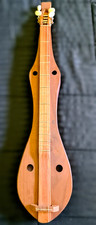 Compact 29" Appalachian dulcimer also widely known as a mountain dulcimer .
