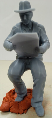A man reading a newspaper 3D Print in scales