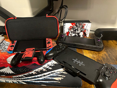 Nintendo Switch Console Bundle w/ Dock, Controller, CRKD Nitro Deck, and Case.