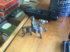 Cast iron police officer on horse