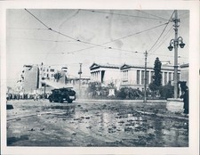 1953 Photo Debris Military Vehicle Building Outside Weather Vintage Image