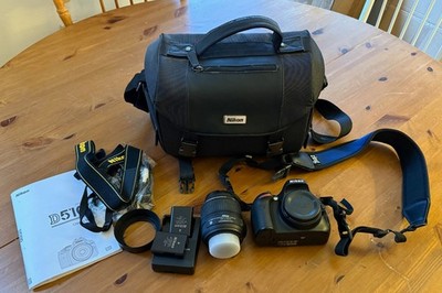 Nikon D D5100 16.2MP Digital SLR Camera Kit w/ AF-S DX VR G 18-55mm lens & xtras