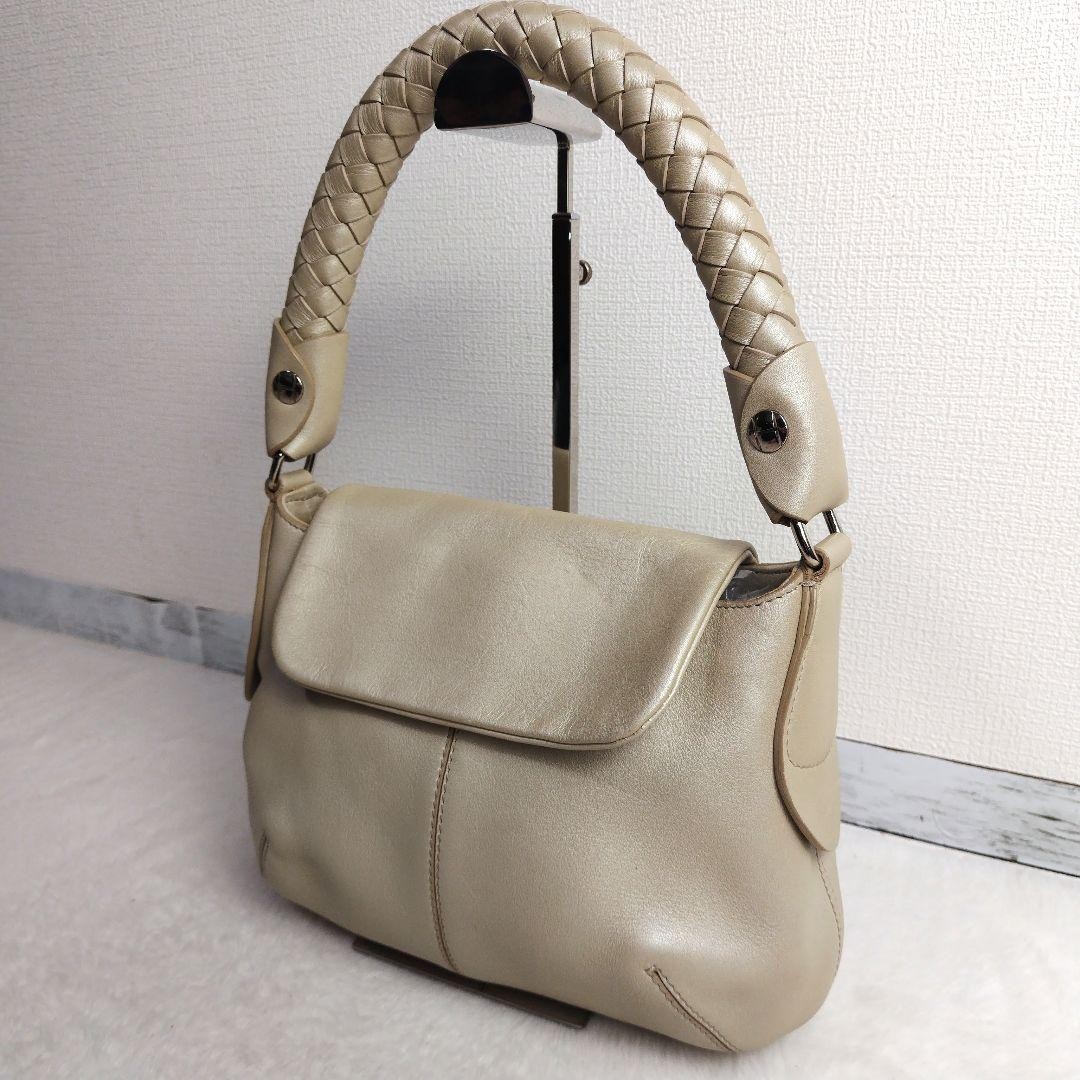 Bolso de hombro de cuero perlado HIROFU, asa trenzada, usado, elegante