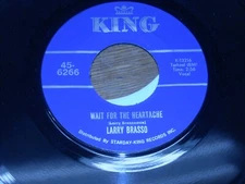 45 RECORD,  LARRY BRASSO.  WAIT FOR THE HEARTACHE /  YOU'RE GONNA GET WHATS.
