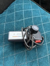 ATARI GAME CONTROLLERS AND ONE ATARI TV GAME 