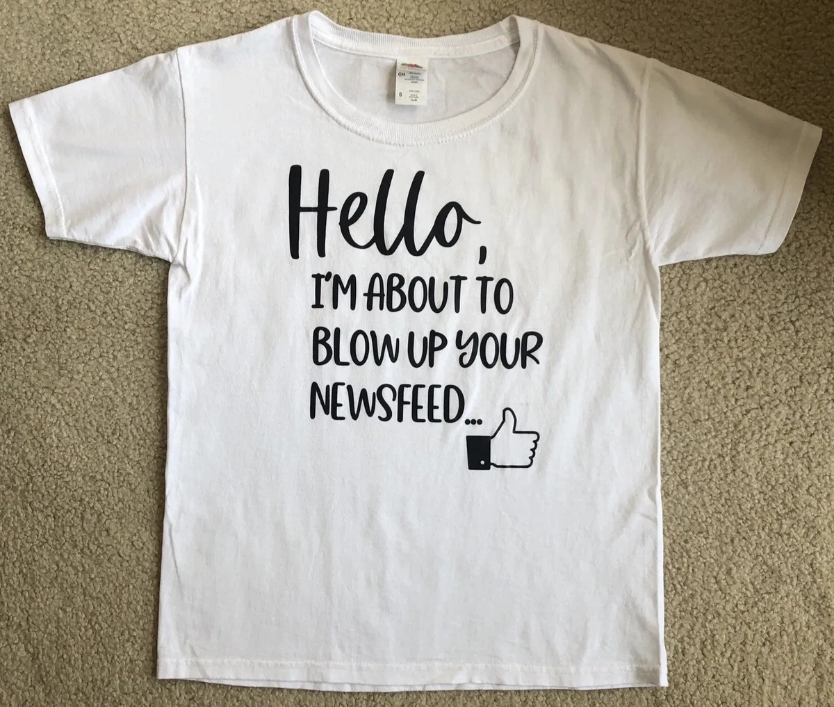 white shirt with black writing