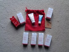 9 x Clarins exfoliator, hydra quench cream,eye concentrate, toners,cleansers,bag