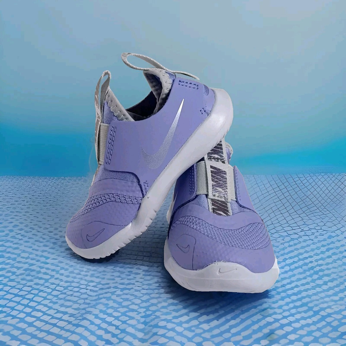 purple nike flex runner