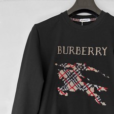 Duty Paid: Burberry Sewn Horse Logo on Chest Black Sweater Size S