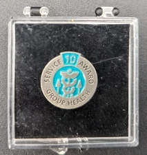 GROUP HEALTH 10 YEAR SERVICE AWARD PIN 3/4" ACROSS