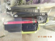 Two Epson 273 Photo Black Ink Cartridges and one Magenta GENUINE Epson.