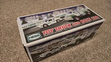2011 ~ HESS TOY TOW TRUCK and RACE CAR ~ NEW IN BOX UNOPENED