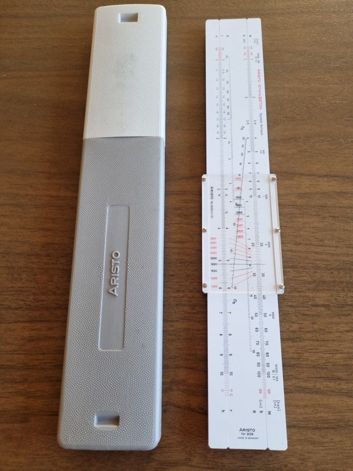 A specialized German-made Aristo slide rule designed specifically for reinforced concrete engineering — a hyper-niche artifact of Cold War-era European technical precision.