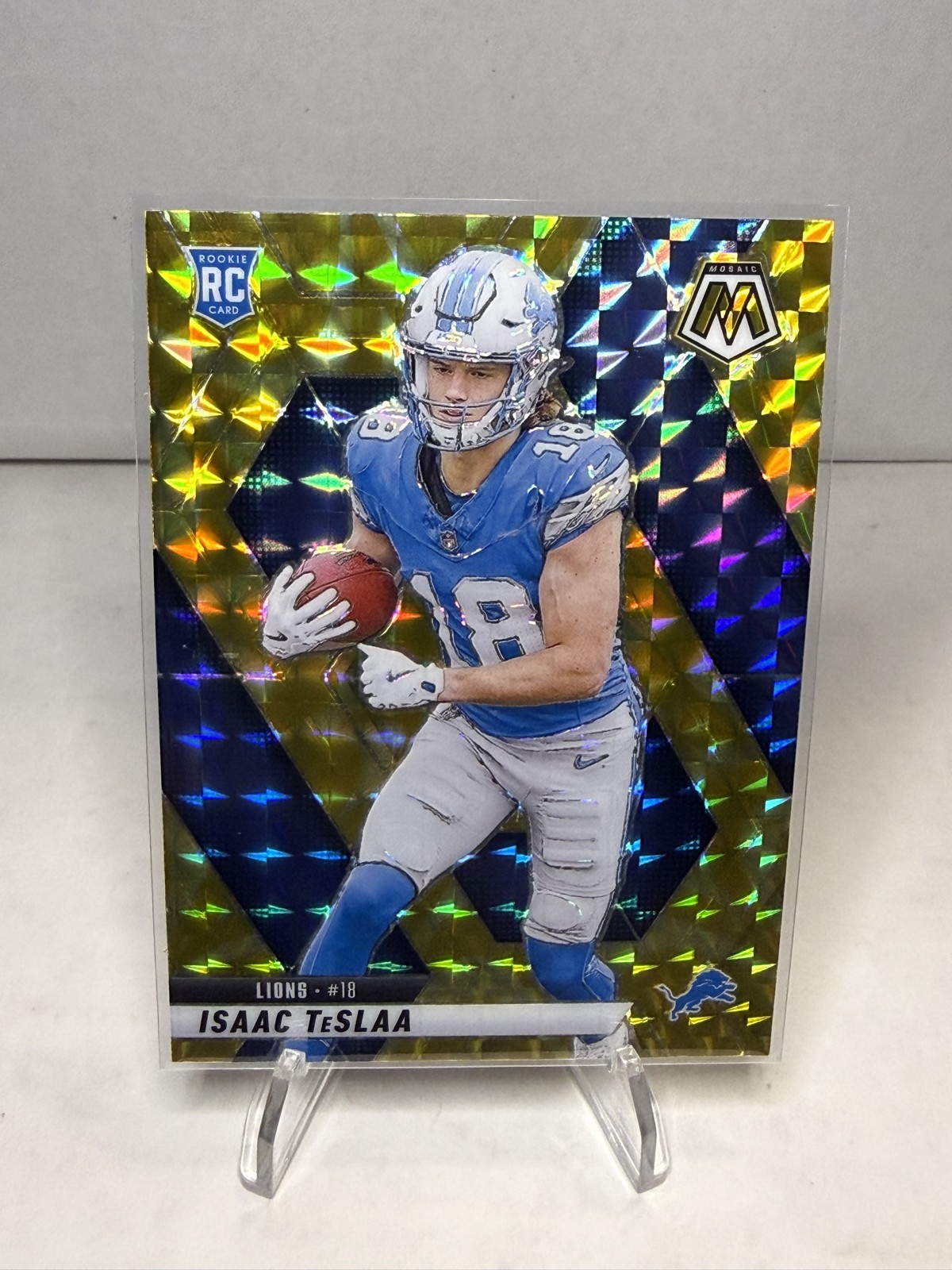 2025 Panini Mosaic - Rookies Isaac Teslaa #319 Reactive Yellow Mosaic Prizm (RC)