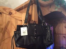 Black genuine leather . Never used handbag 
