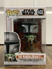 Funko Pop! Vinyl: Star Wars - The MANDALORIAN with the CHILD (#402)