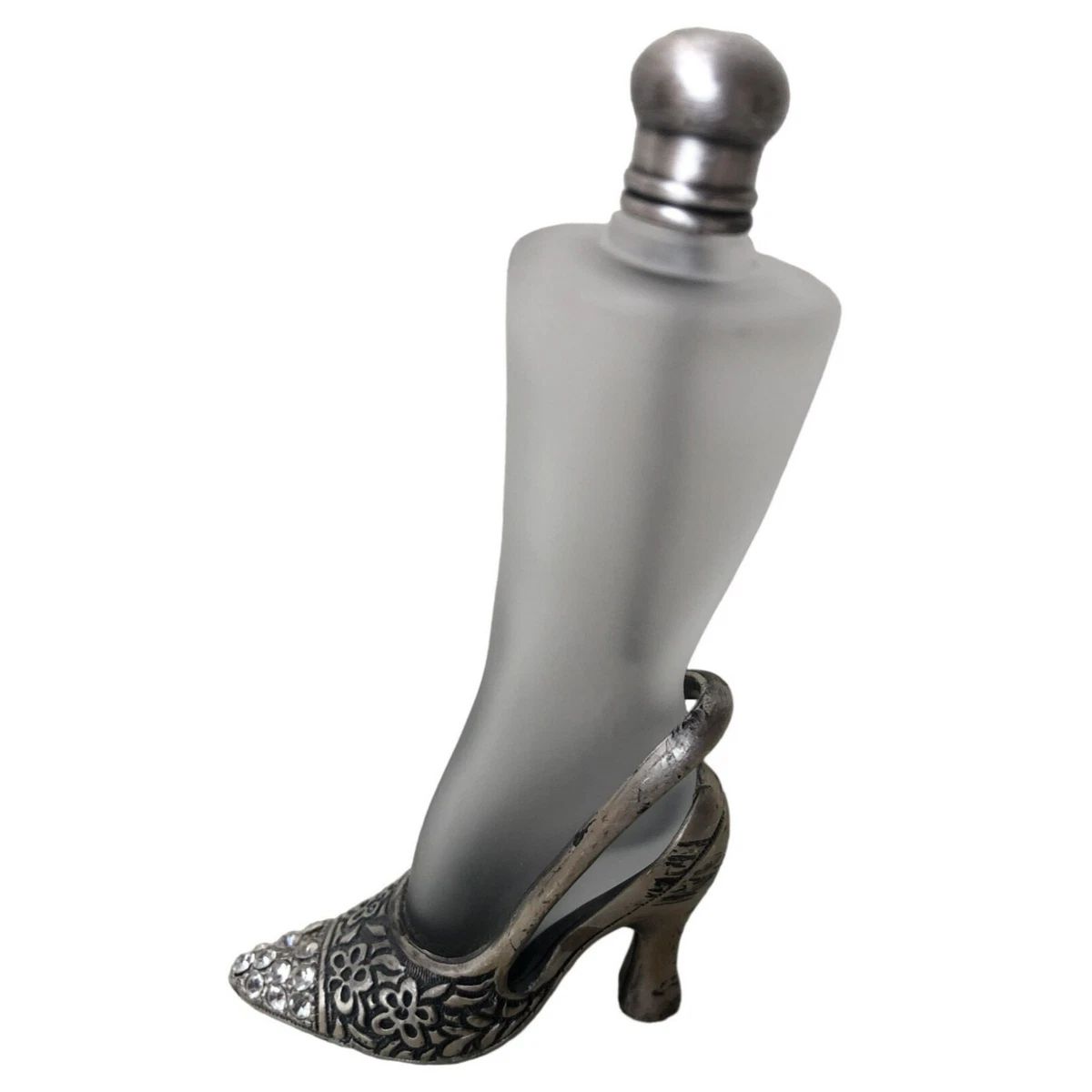 Carolina Herrera Good Girl fragrance in its shoe-shaped bottle standing on  a gold stiletto heel. | Wewangian