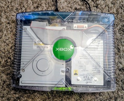 This is an original Xbox (black)With an aftermarket ghost case 2/3rds shell. 