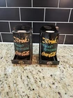 Pair vintage Coca-Cola match holders "Drink Delicious Refreshing Coca-Cola"