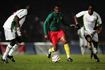 Sameul Eto'o of Cameroon takes on Lamine Diatta Souleymane Diawar- 2005 Photo