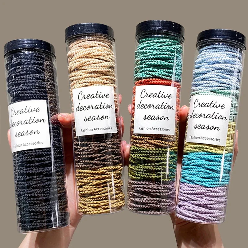 Bandas elásticas para el cabello de goma maciza de 100 piezas Foto 3 de 4