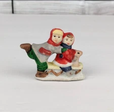 Christmas Village Ceramic Bisque Figure Children Playing on a Sled Snow 1.5"x2"