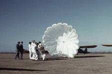 Instructor explaining operation of a parachute to student pilots M- Old Photo 7