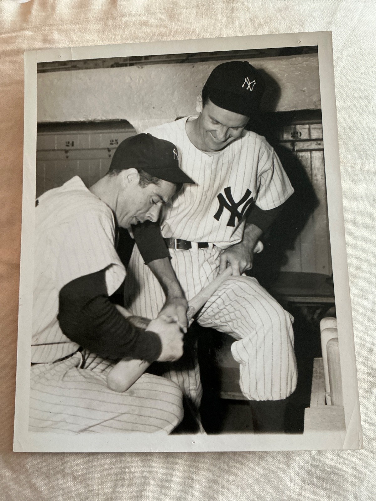 Joe DiMaggio Rubbing Bat Before 1947 World Series Game Opener Press Photo
