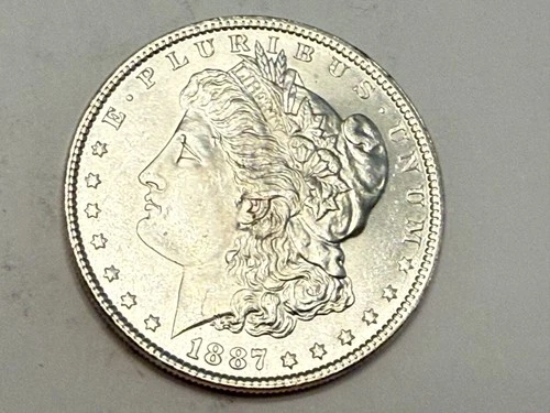 1887 Morgan U.S. silver dollar. Near gem BU, white deep satin luster. #ru3
