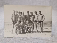 Shirtless  young Guys muscles press.