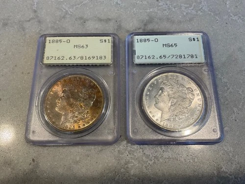 Lot of 2 1885 O Morgan Silver Dollar  MS 65 & MS 63 toned PCGS rattlers