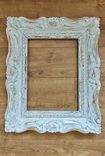 Cadre ancien en bois sculpté