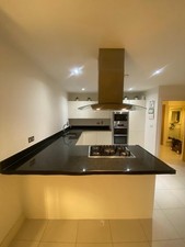 Kitchen units with granite worktops used white no appliances 
