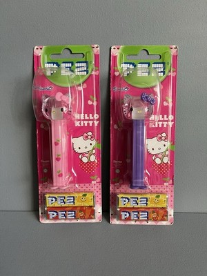   2 Sammlerstücke Sanrio Hello Kitty rosa & lila PEZ Spender (2015) versiegelt