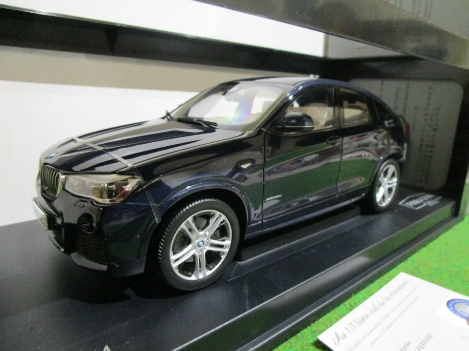 BMW X4 bleu 4x4 échelle 1/18 de PARAGON PA-97092 voiture miniature de collection - Photo 1/4