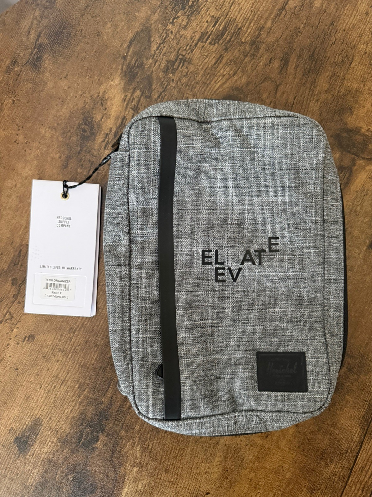 This Herschel Supply Co. Tech Organizer in Raven Crosshatch ELEVATE
