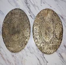 Pair of vintage oval embossed hot iron, hot pot mats