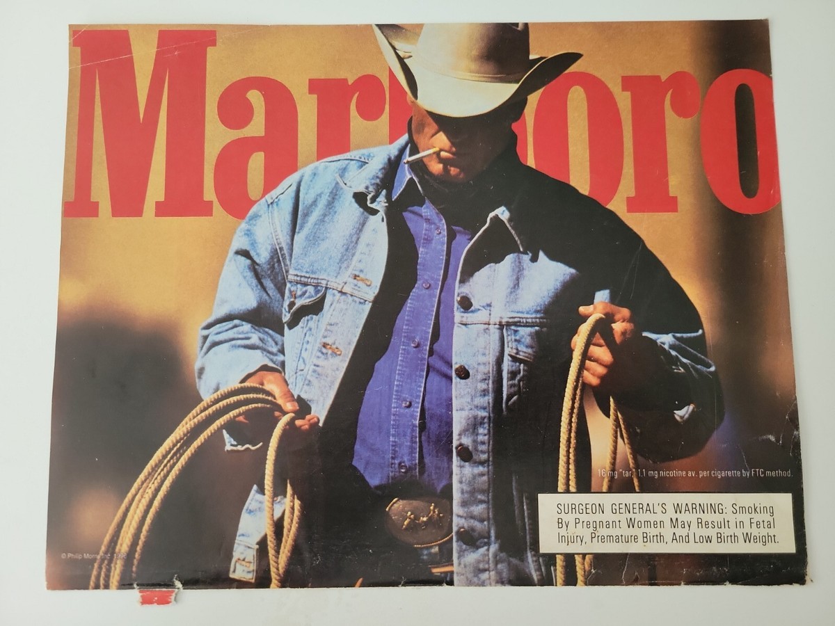 1996 Marlboro red cigarettes handsome cowboy smoking Jean jacket vintage ad