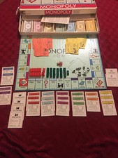 1961 Monopoly Game  missing "go to jail" card and has mix matched dice 