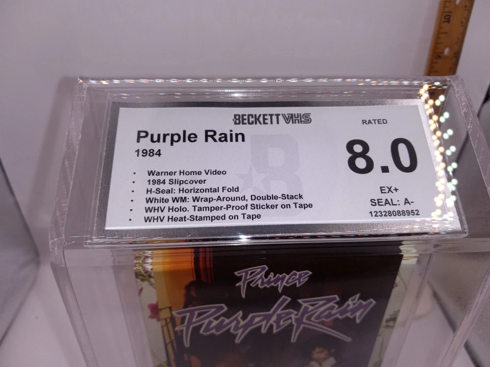 PURPLE RAIN 1984 VHS BECKETT Graded 8.0 GREAT WATER MARKS --40 YEARS OLD Foto 2 de 4
