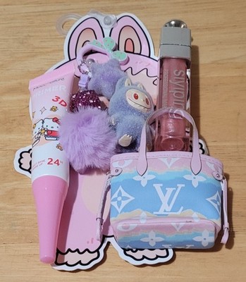 Gift Bag With Hello Kitty Primer a Lipgloss a Doll Handbag And A Keychain