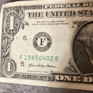 One dollar bill birthday Note fancy serial number April 2, 1985. Number 19850402