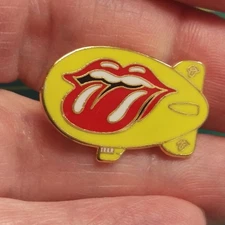 Rolling Stones Blimp Pin Yellow Blimp with Rolling Stones Tongue Logo 5/8" tall